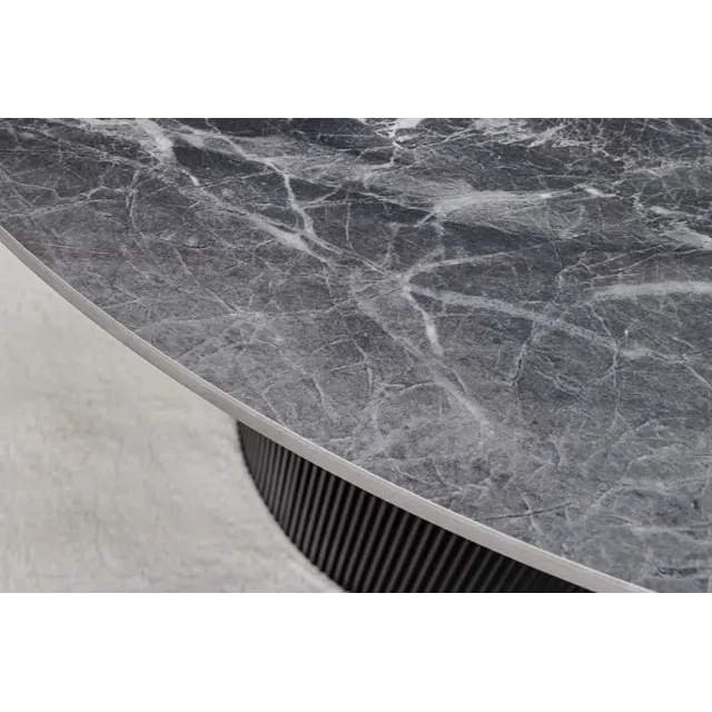 Table à manger ronde UNIQUE Ø120 cm – Plateau en céramique noire effet marbre & pied colonne Table à manger ronde UNIQUE Ø120 cm – Plateau en céramique noire effet marbre & pied colonne